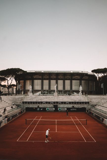 Aerial view of a tennis match at Foro Italico stadium in Rome, Italy.