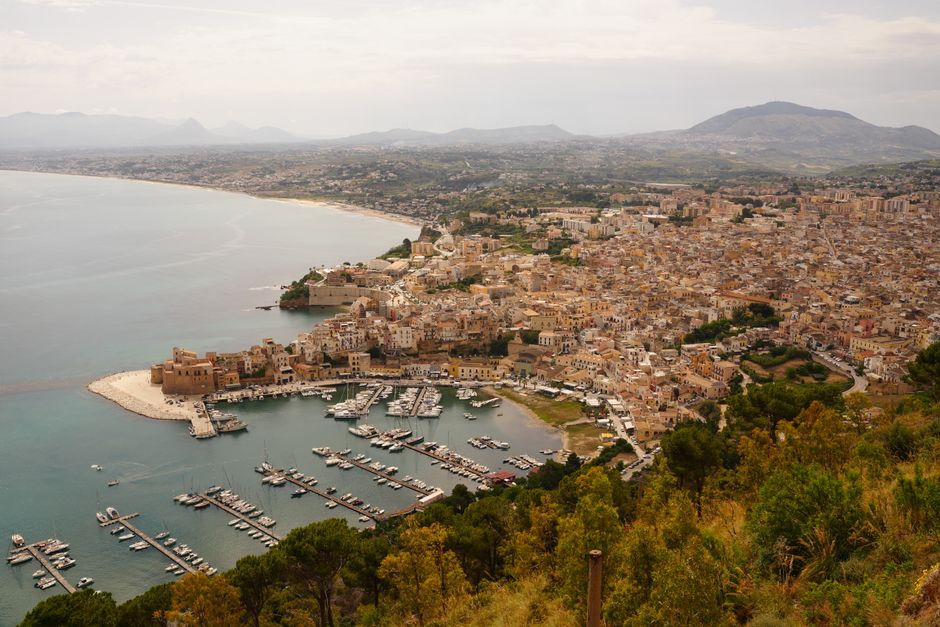 Beautiful aerial photograph of Castellammare del Golfo's coast and marina in Sicily, Italy.