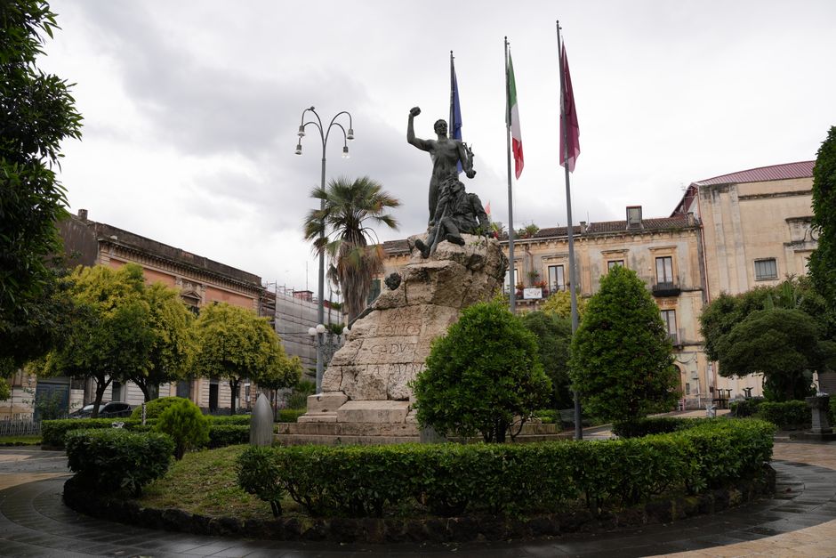 Monument to the Fallen located in Piazza Garibaldi, Acireale, Sicily, captured on a cloudy day.