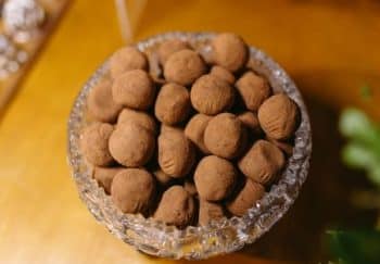 A beautiful display of chocolate truffles in a crystal bowl, perfect for indulgent desserts.