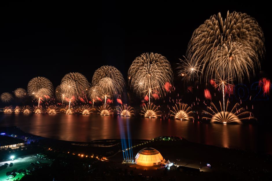 A breathtaking night view of fireworks over the waterfront in Ras Al-Khaimah, UAE.