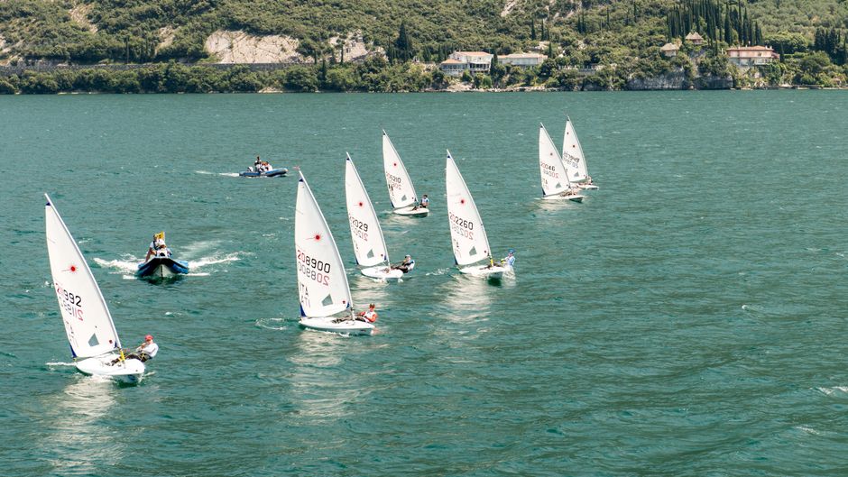 Aerial view of sailboats competing in a race on Lake Garda, Italy.