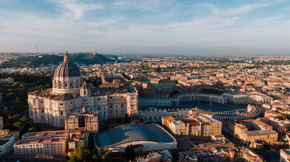A breathtaking aerial view of St. Peter's Basilica and Vatican City in Rome during daytime.