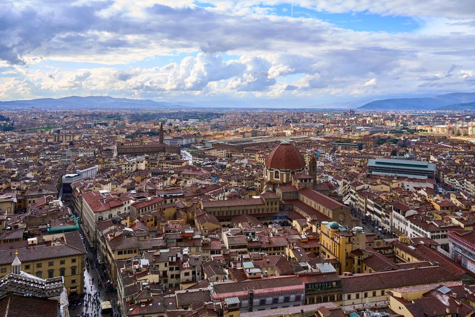 Discover the breathtaking aerial view of Florence with the iconic red dome and sprawling city center.