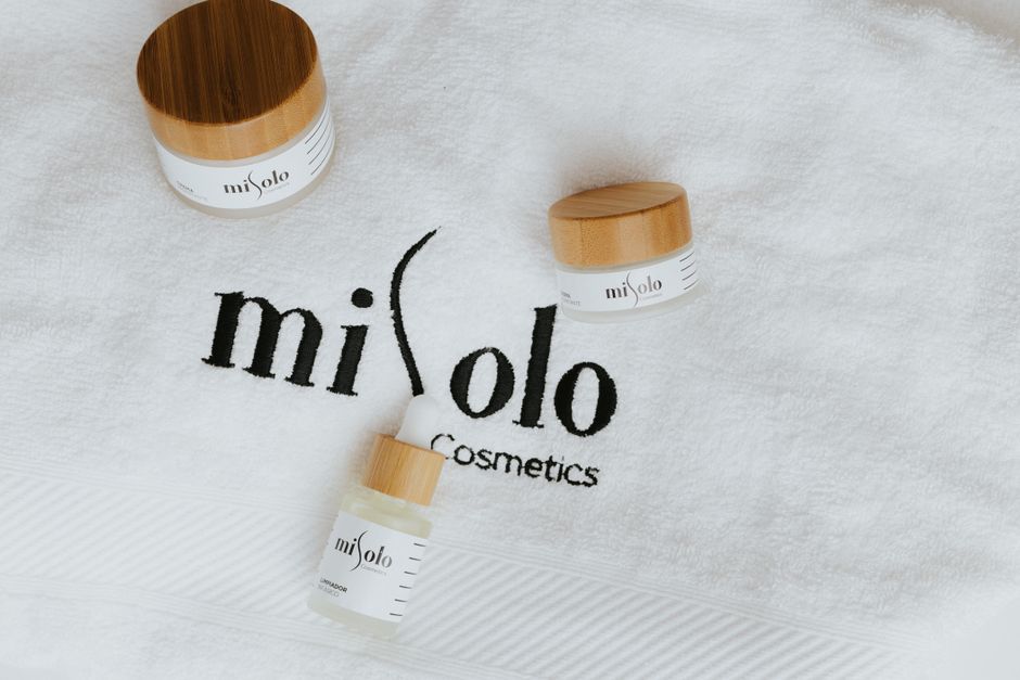 High-end cosmetics displayed on a soft white towel, embodying luxury skincare.