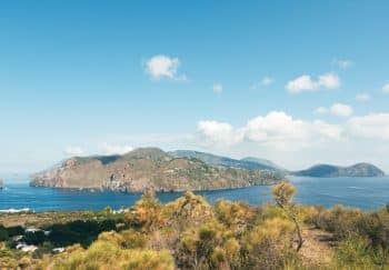 Beautiful panoramic view of Panarea Island with clear skies and calm sea in summer.