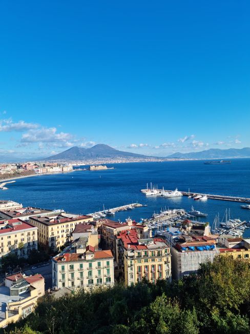 Beautiful aerial view of Naples harbor and Mount Vesuvius on a clear summer day.