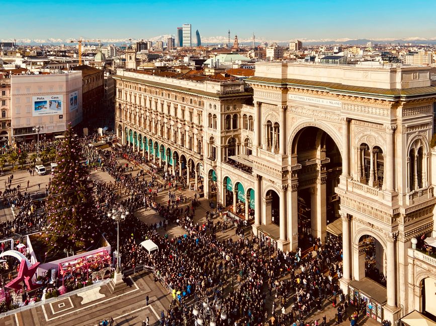 A bustling scene at Galleria Vittorio Emanuele II in Milan during the holiday season.