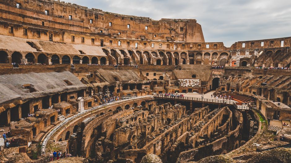 Explore the iconic Colosseum's ancient architectural wonders in Rome, Italy.