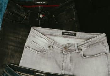 Top view showcasing various denim jeans in different shades and styles.