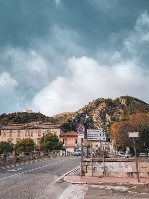 Explore the scenic streets of Sora, Lazio with rustic Italian architecture and lush hillside views.