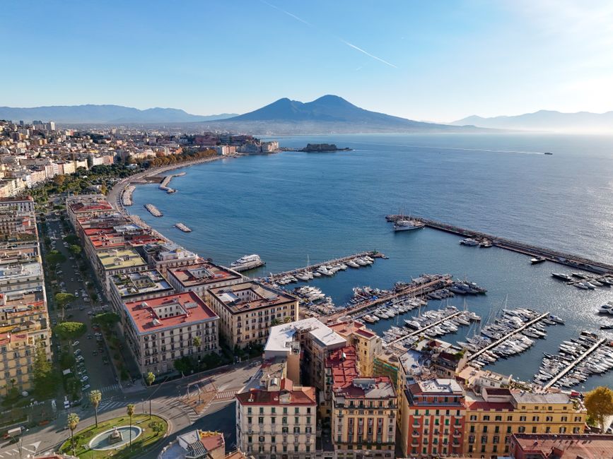 Stunning aerial view of Naples, Italy with Mount Vesuvius and marina.