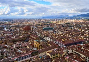 A breathtaking aerial view of Florence, Italy, showcasing its iconic historic architecture and surrounding hills.