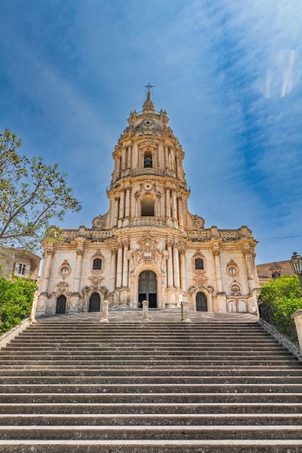 Stunning view of a historic Baroque cathedral in Modica, Sicily with stone stairway.