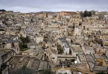 Aerial view of the ancient stone buildings in Matera, showcasing historic Italian architecture.