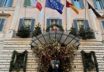 Elegant facade of an Italian building decorated for the holidays.