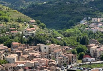 Breathtaking panoramic view of the medieval townscape in Cosenza, Italy under a summer sky.