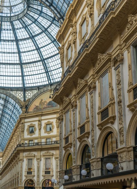 Stunning architectural details of Galleria Vittorio Emanuele II in Milan with glass dome.