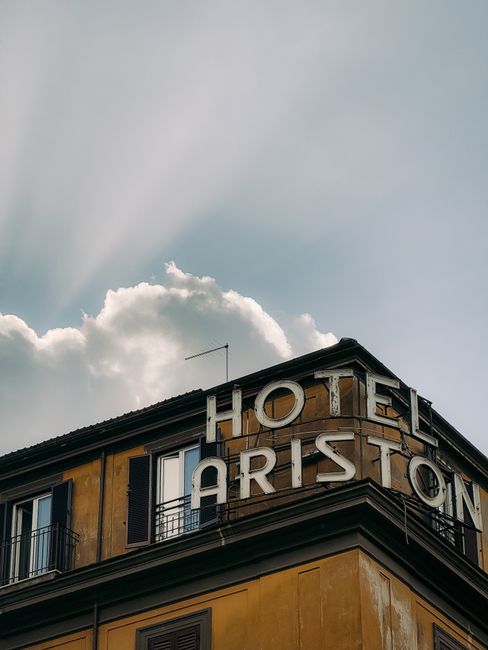 Hotel Ariston facade with clouds in Rome, Lazio, Italy. Captured with artistic flair.