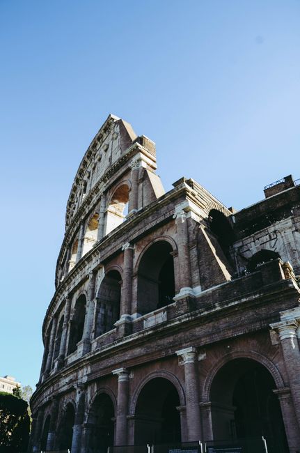 Stunning vertical shot of the iconic Colosseum in Rome, a must-visit historical landmark.
