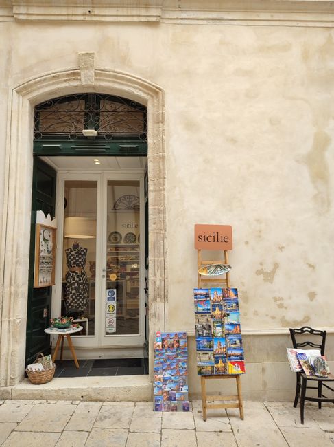 Discover this quaint souvenir shop in Scicli, Sicilia, with postcards and Italian charm.