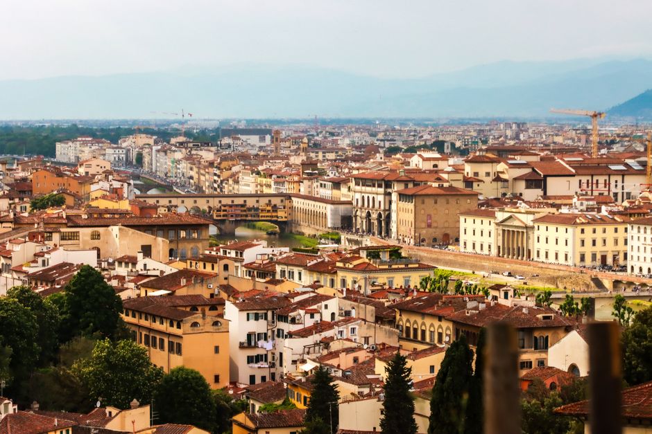 Panoramic view of Florence cityscape, showcasing historic architecture and the Arno River in Tuscany, Italy.