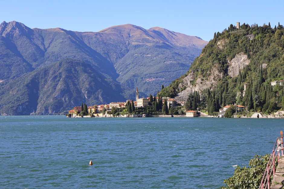 Beautiful summer panorama of Varenna and Lake Como with mountains in the background.