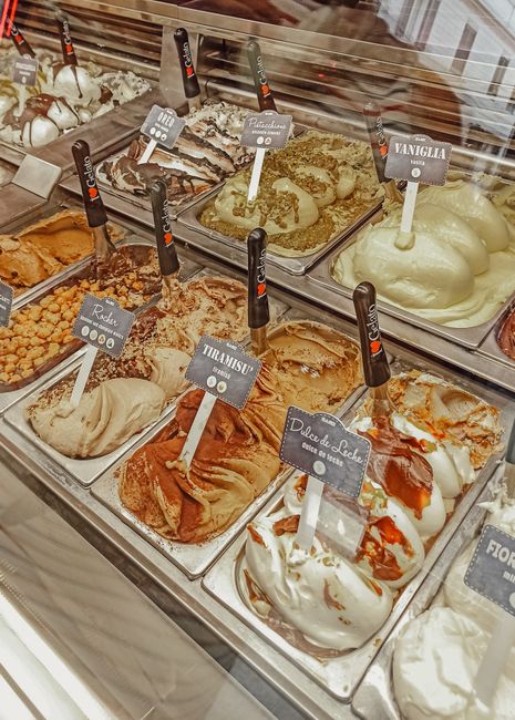 Wide selection of delicious artisan gelato flavors on display in a Rome gelateria, Italy.