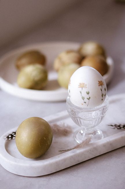 Elegant Easter egg with floral design on a marble tray, Italy.