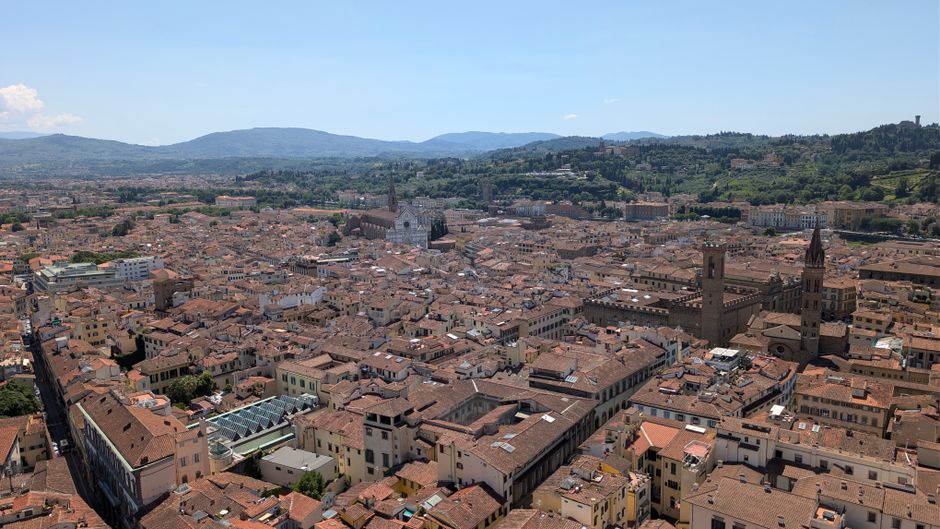 Stunning aerial view of Florence, Italy, capturing its historic architecture and scenic Tuscan surroundings.