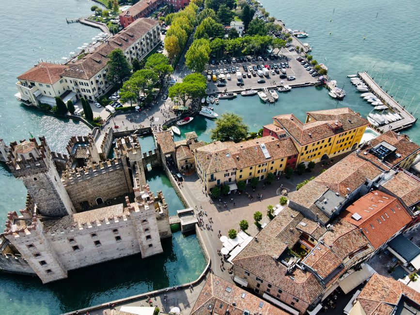Stunning overhead view of Sirmione, Italy, featuring the historic castle and vibrant town.